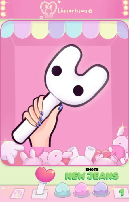 New Jeans light stick emote: white bunny-shaped stick with black eyes held by a hand with blue nails